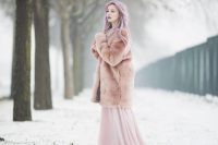 06 a bride with pastel hair rocking a pink A-line wedding dress with a tain and a pink faux fur coat for a dreamy and beautiful look