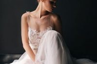 06 a sleeveless illusion bodice A-line wedding dress with a layered tulle skirt is gorgeous and chic