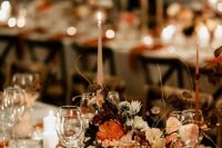 07 a sophisticated earthy-tone wedding tablescape with orange, rust, blush blooms and twigs, orange napkins and neutrals for a contrast