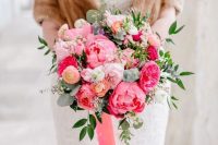 08 a coral charm peony, pink rose, blush garden rose, and coral ranunculus wedding bouquet with greenery and ribbons for a winter wedding