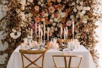 08 a fantastic earthy-tone flower wall with dried leaves is a gorgeous idea for an elegant fall wedding, it can be used as a ceremony backdrop and a reception backdrop