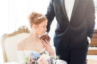 08 the bride and the groom wearing Bridgerton-inspired looks – a black tux and an off the shoulder wedding ballgown with a gorgeous tiara and statement earrings