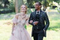 09 the couple dressed in attire inspired by Bridgertons – a chic take on a black morning suit and a blush off the shoulder wedding dress with floral embroidery