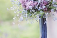 10 a beautiful and lush wedding bouquet of lilac and perinwinkle blooms plus matching long ribbons is an amazing idea for spring