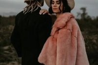 10 a gorgeous pink faux fur coat over a romantic boho lace wedding dress plus a hat for a boho bridal look in fall or winter