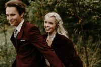 10 a neutral wedding dress with a high neckline, a burgundy faux fur jacket and an embellished headpiece for a Christmas wedding