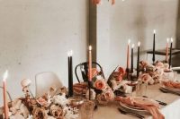 11 a beautiful earthy-tone wedding tablescape with neutral, rust, coral and orange blooms, copper napkins and candles and matching fabric strips over the table