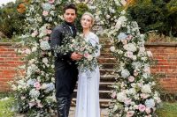 11 a lush pastel floral wedding altar and the couple dressed in vintage looks – a modenr take on the Duke’s look and a delicate vintage-inspired wedding dress plus a tiara