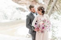 12 a modern blush wedding dress and a matching top with floral appliques, rhinestone earrings and a hairpiece plus a lush blush and hot pink wedding bouquet wow