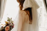 12 an oversized tulle bow like this one ia very trendy and chic alternative to a usual wedding veil and looks very feminine-like