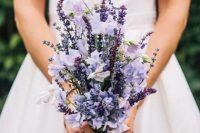 13 a beautiful very peri wedding bouquet is a creative idea for a spring or summer wedding, and subtones give more dimension to the arrangement