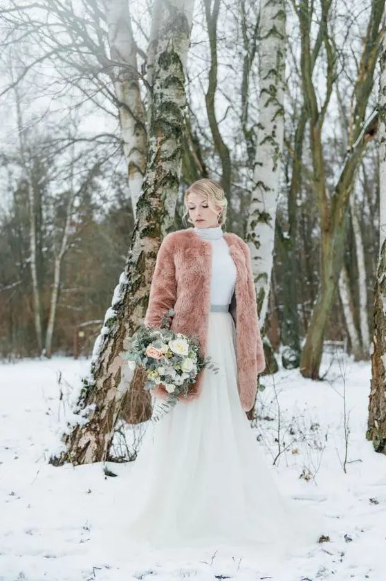 a teddy coat is a nice cover up for a winter bride