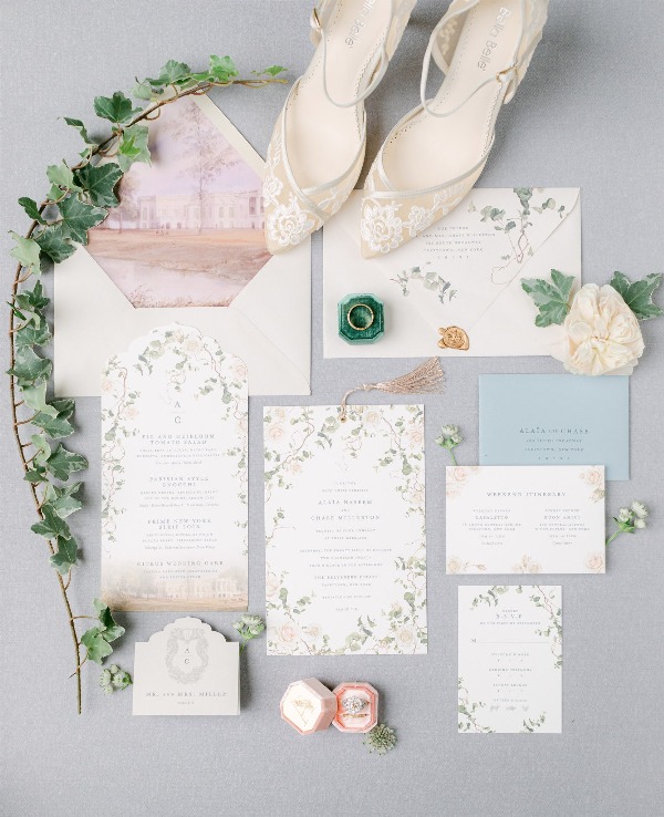 a chic wedding invitation suite with floral prints, with a mansion painted on the lining plus gold touches is amazing