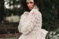 15 a unique white crochet  bridal jacket fully covered with fringe and tassels is ideal to accessorize a boho bridal look