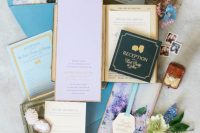 16 beautiful and dreamy Bridgerton-inspired wedding invitation suite with impressionist style floral lining and blue envelopes