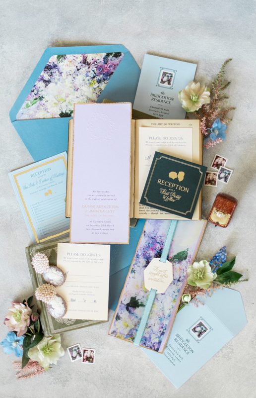 beautiful and dreamy Bridgerton-inspired wedding invitation suite with impressionist style floral lining and blue envelopes