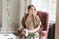17 a refined winter bridal look with a sequin bodice with a V-neckline, a pink skirt, a brown faux fur cover up and a bold lip