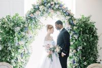 18 a beautiful lush wedding arch covered with lots of greenery and pastel-colored florals is a fabulous idea for a Bridgerton wedding.jpg