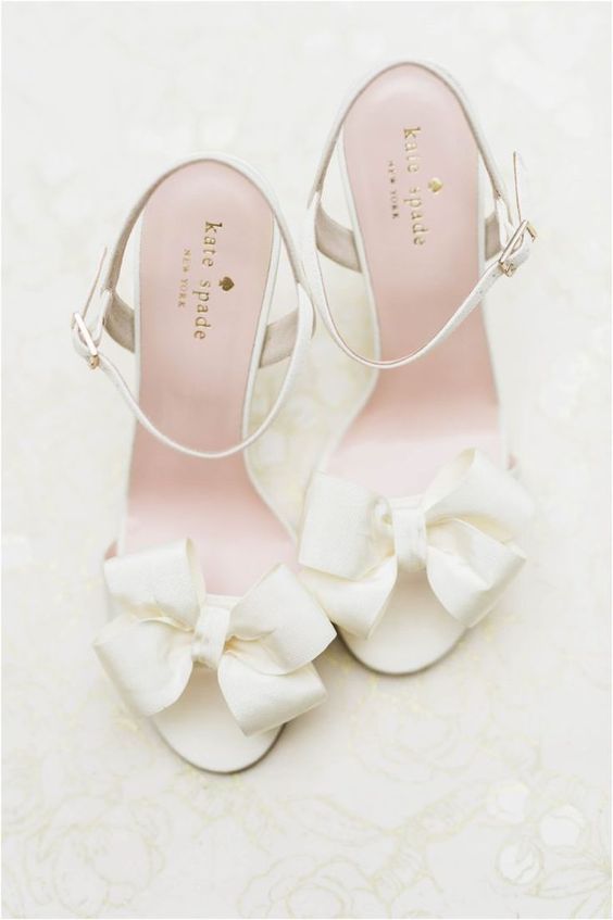 delicate and girlish white bow wedding shoes with ankle straps will add a girlish feel to your bridal look at once