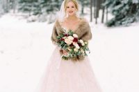 22 an exquisite bridal look with a blush wedding ballgown, a neutral faux fur shawl, a veil and a bold lip is classics for winter