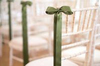 24 a white chair accented with a green bow and nothing else for a chic and tasteful wedding aisle look