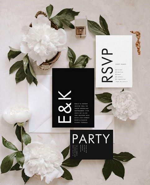 a modern black and white wedding invitation suite with cool text and bold monograms is amazing