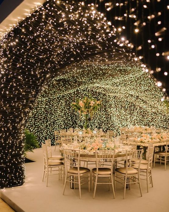 a cool indoor wedding light canopy