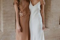 48 a classic silk slip maxi wedding dress with a train and with a deep neckline will never go out of style and always looks gorgeous