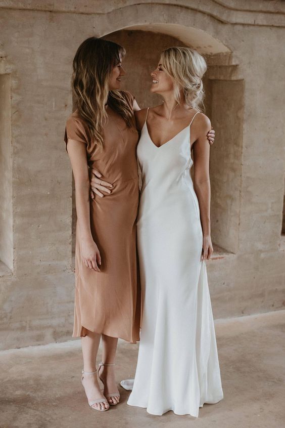 A classic silk slip maxi wedding dress with a train and with a deep neckline will never go out of style and always looks gorgeous