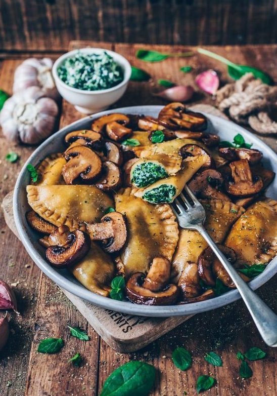vegan spinach ravioli with fried mushrooms with garlic and parmesan is a hearty meal for a vegan wedding