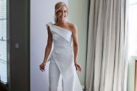 57 a modern bridal jumpsuit – a one shoulder one and a skirt with a train on the side is a wow idea