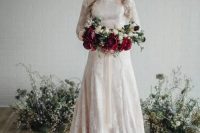 69 a blush wedding dress with white lace appliques, a train and long sleeves looks feminine
