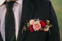 a graphite grey blazer with a colorful pocket square done with pink, hot pink and red blooms, berries and seeded euclayptus