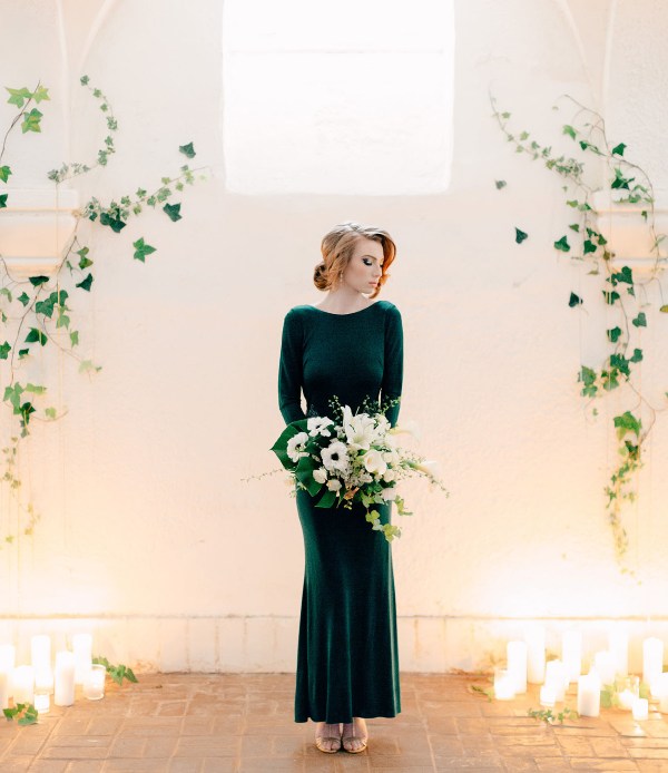 a modern bridal look with a plain green midi dress with a high neckline, long sleeves and shiny shoes is a bold idea