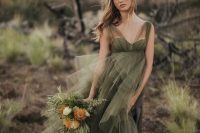 a moody green wedding dress with wide illusion straps, a sweetheart neckline and a layered tulle skirt for a moody fall bride