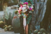 a perfect green sequin wedding dress with a bateau neckline, long sleeves and a slit is a fantastic idea for a modern desert or just boho bride