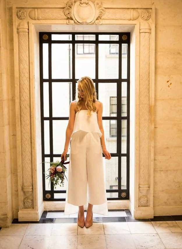 a stylish and girlish bridal look with a strapless ruffle top and culottes with pockets plus blush suede shoes