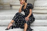12 a gorgeous black and white floral midi dress with a square neckline and puff sleeves, black heels and statement jewelry