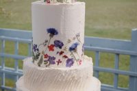 12 a multi-tier white buttercream wedding cake with bold pressed flowers and leaves is a fabulous idea for a bright summer wedding