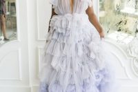 13 a beautiful lilac A-line wedding dress with a tulle bodice, tulle bows on the shoulders and ruffle tier skirt with a train