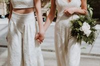 15 one bride wearing a lace separate with a crop top and culottes, and the other bride rocking an embbelished separate with a crop top and pants