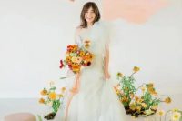 19 a pale green one shoulder wedding dress with layers of tulle on top is a delicate and chic idea for a spring or summer bride
