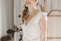 21 a gorgeous bridal look with a lace fitting crop top with cap sleeves and a V-neckline, high waisted plated palazzo pants with pockets
