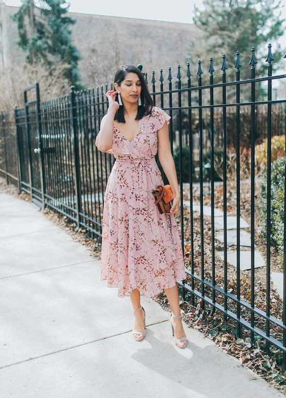 a light pink floral wrap midi dress with ruffle cap sleeves, grey shoes and a brown bag