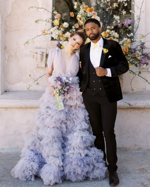 a delicate and sophisticated lavender wedding dress with a tulle bodice and a ruffle skirt just wows with its unusual color