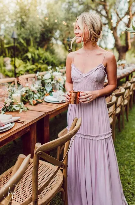a cute mauve maxi dress with ruffles and on spaghetti straps is an amazing romantic idea for a summer wedding outdoors
