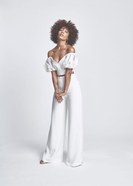 a pretty and playful bridal look with an off the shoulder crop top with puff sleeves, high waisted palazzo pants and cool earrings
