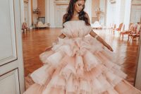 29 a fantastic blush ruffle strapless wedding dress that features only tiers of tulle ruffles will make a bold statement