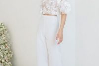 33 a super romantic and airy bridal look with a lace applique crop top with short sleeves, plain high waisted pants, white heels and floral earrings