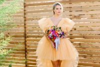 37 a jaw-dropping yellow tulle high low ruffle wedding dress and navy shoes with floral detailing